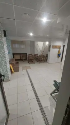 a large room with tables and chairs in it at Belvedere Holiday Club - Mountain View in Bansko