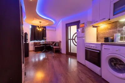 a kitchen with a washer and dryer in a room at Cozy Apart TOP Center AUBG Free Garage Parking in Blagoevgrad