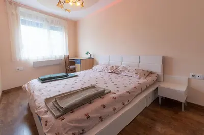 a bedroom with a large bed in a room at Cozy Apart TOP Center AUBG Free Garage Parking in Blagoevgrad