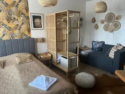 a room with a bedroom with a bed and a book shelf at Luxury Studio in Alpinе Lodge FREE SPA in Bansko