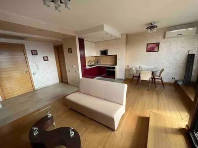a living room with a couch and a table at Silver city in Sofia