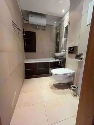 a bathroom with a toilet and a sink at Silver city in Sofia