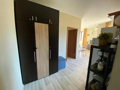 a large black cabinet in a living room at DeLuxe Apartment 2OOm from Gondola in Bansko