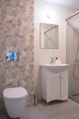 a bathroom with a toilet and a sink and a shower at Madrid: A modern 2-bedroom apartment with parking in Sofia