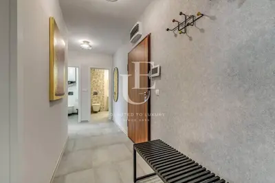 a hallway with a bench in a house at Madrid: A modern 2-bedroom apartment with parking in Sofia