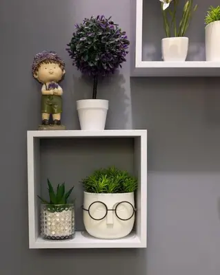 a white shelf with potted plants and a doll at Beauty downtown - TOP CENTER in Sofia