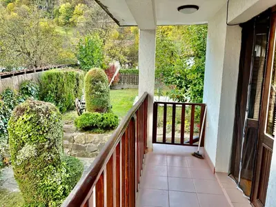 a porch of a house with a view of a garden at Vila Omainiche Ribarica in Ribarica
