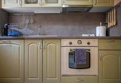 a kitchen with a sink and an oven in it at Elegant spotless apartment in Sofia Center in Sofia