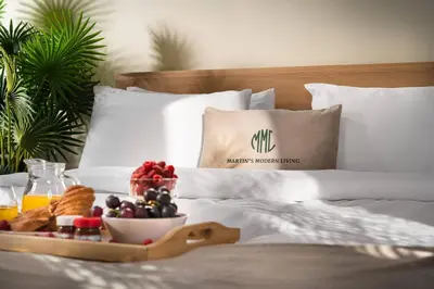 a tray of fruit and bread on a bed at Free Parkingon Premises & Enjoy in Sofia