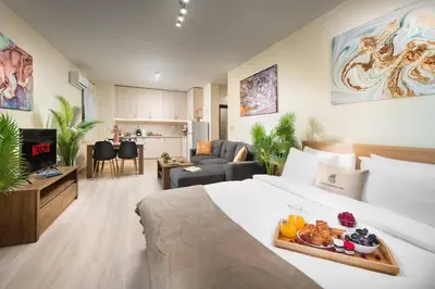a hotel room with a bed with a tray of food on it at Free Parkingon Premises & Enjoy in Sofia