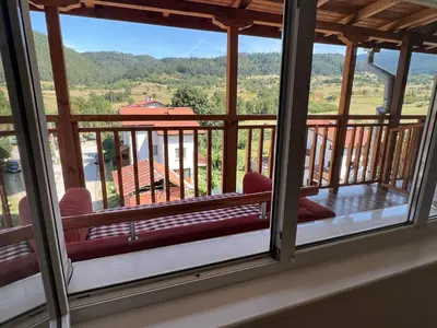a view from the balcony of a house with a view at Alpine Nest: 6km to ski slopes in Beli Iskar