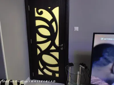 a black and yellow door in a room with a picture at Тристаен апартамент в центъра in Sofia