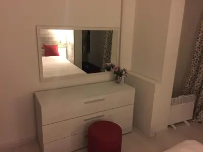 a bedroom with a dresser and a mirror at Apartment South Park - Louis Eyer in Sofia