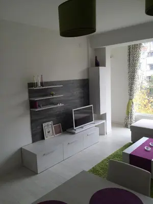 a living room with a tv on a dresser at Apartment South Park - Louis Eyer in Sofia