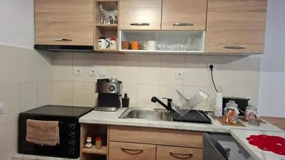 a kitchen with a sink and a microwave at Apartment for rest in Borovets in Borovets