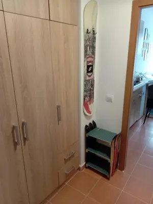 a room with a door and a skateboard on the wall at Apartment for rest in Borovets in Borovets