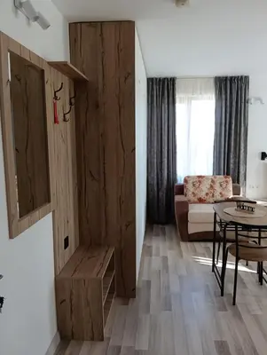 a living room with a couch and a table at Monfort A in Bansko