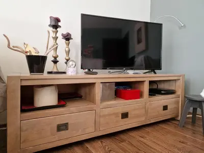 a wooden entertainment center with a flat screen tv on it at Bansko Royal Towers - 2BD Flat with Parking by Flat Mаnager in Bansko