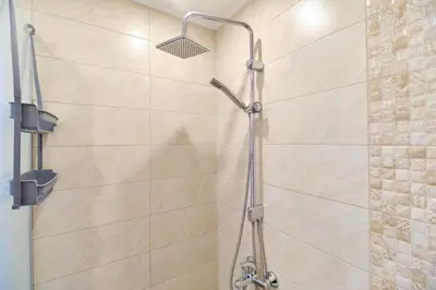 a shower in a bathroom with a glass door at Cozy 1-bed Apartment 2 in Plovdiv