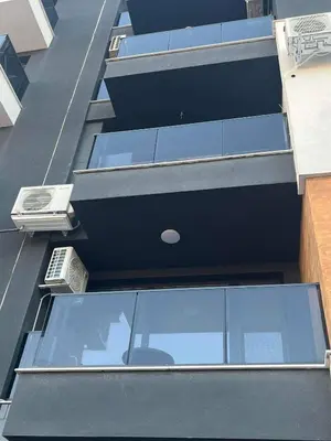 an overhead view of a building with glass windows at Ultra Lux Studio Free Underground Secure Parking in Pazardzhik