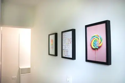 three framed pictures of a candy on a wall at Stylish and Quiet Apt with Balcony in Sofia