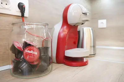 a red appliance sitting on a counter next to a mixer at Stylish and Quiet Apt with Balcony in Sofia