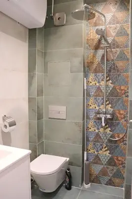 a bathroom with a toilet and a shower at Stylish and Quiet Apt with Balcony in Sofia