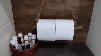 a basket of candles and a roll of toilet paper at Sofia Center Chic Suite - Separate Kitchen and Balcony in Sofia