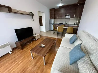 a living room with a couch and a table at Nice apartment in Belvedere Club in Bansko