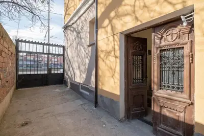 an entrance to a building with a wooden door at Stylish Stay - 2BDR, 2BTHR+ Free Parking in Sofia