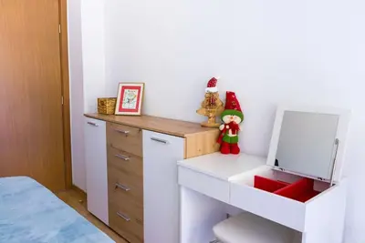 a bedroom with a white desk with a mirror at Mountain Apartment in Borovets Ski Resort in Borovets