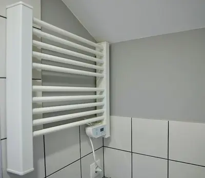 a white shelf in a room with white tiles at Lily's Studio 3 by Bulgarentals - Central Sofia in Sofia