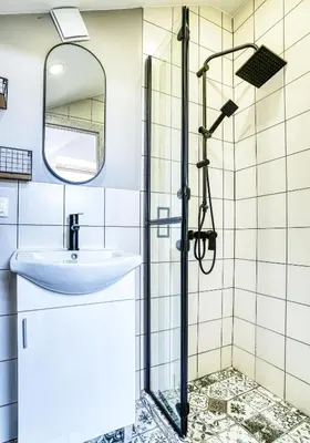 a bathroom with a sink and a shower at Lily's Studio 3 by Bulgarentals - Central Sofia in Sofia