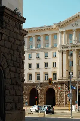 a large building with cars parked in front of it at Lily's Studio 4 by Bulgarentals - Central Sofia in Sofia