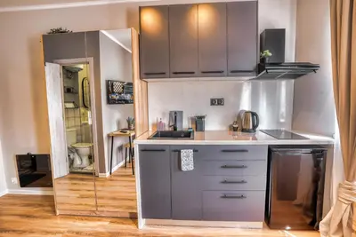 a kitchen with stainless steel cabinets and a sink at Lily's Studio 4 by Bulgarentals - Central Sofia in Sofia