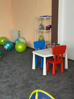 a room with chairs and a table and balls at Хотел Костенец in Kostenets Village