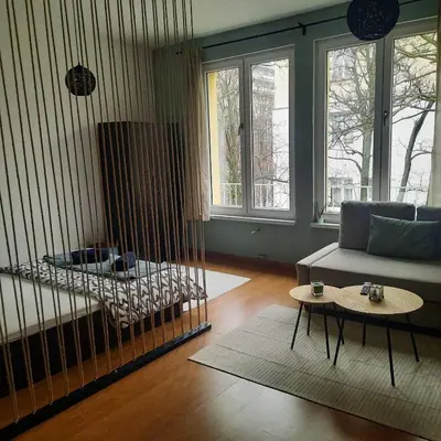 a living room with a couch and a table at Lucky number 7 Studio in Sofia