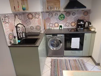 a kitchen with a washing machine and a sink at Lucky number 7 Studio in Sofia
