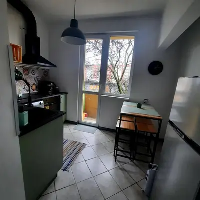 a kitchen with a table and a window and a table at Lucky number 7 Studio in Sofia