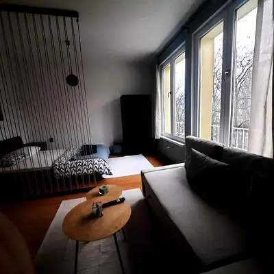 a living room with a couch and a table at Lucky number 7 Studio in Sofia