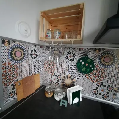 a kitchen with a counter with a tile wall at Lucky number 7 Studio in Sofia
