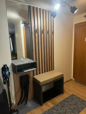 a dressing room with a bench and a mirror at Avelov Art Studio in Pamporovo