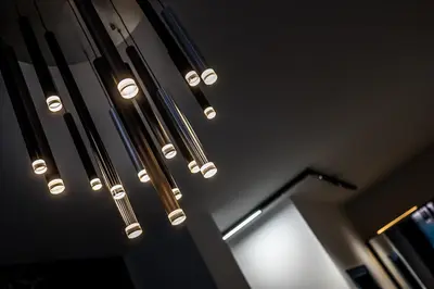 a bunch of lights hanging from the ceiling at ARHEYA 1 apart Архея 1 апартамент за гости in Karlovo