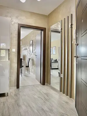 a hallway with a door leading to a dining room at Beautiful & Comfy Apartment for 4 Guest and Free Parking in Plovdiv