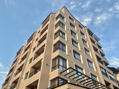a tall tan building with a sky in the background at Beautiful & Comfy Apartment for 4 Guest and Free Parking in Plovdiv
