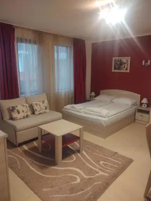 a living room with a bed and a couch at Snow Mountain Grand Monastery in Pamporovo