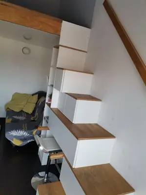 a staircase with white boxes in a room at Sky-view apartmentin perfect city center Sofia in Sofia