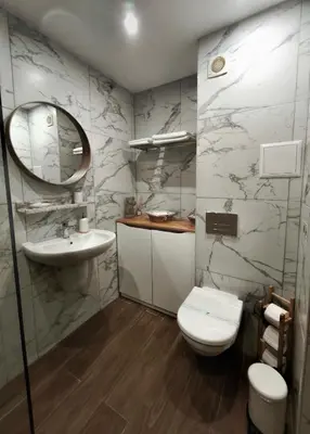 a bathroom with a sink and a toilet and a mirror at Borovets Dream Studio in Borovets