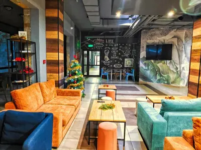 a lobby with couches and a christmas tree at Borovets Dream Studio in Borovets