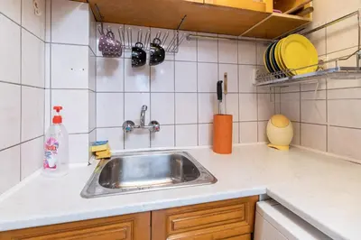 a kitchen counter with a sink in a kitchen at Penthouse Tepeto in Plovdiv